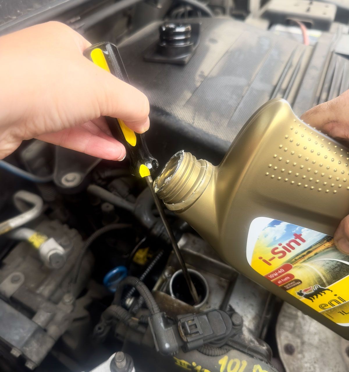 Use a Screw Driver to Pour Out the Oil