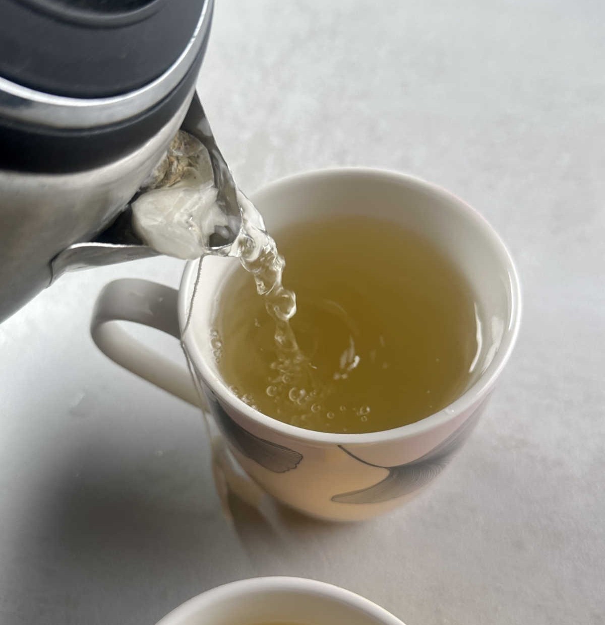 Insert a Teabag into the Kettle Mouth Cap to Serve More Cups of Tea