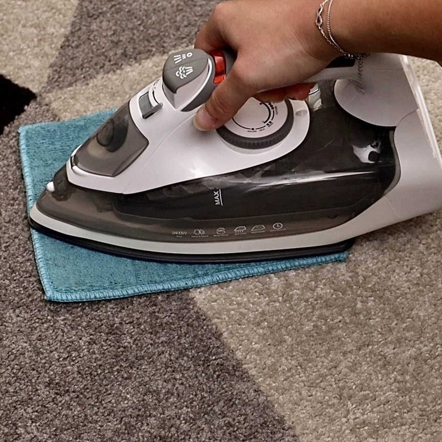 Remove Chair Marks on the Carpet with a Damp Cloth and Iron