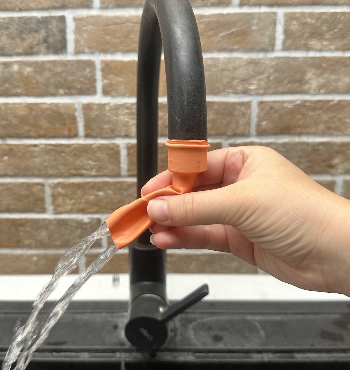 Use a Balloon to Easily Rinse the Sink.