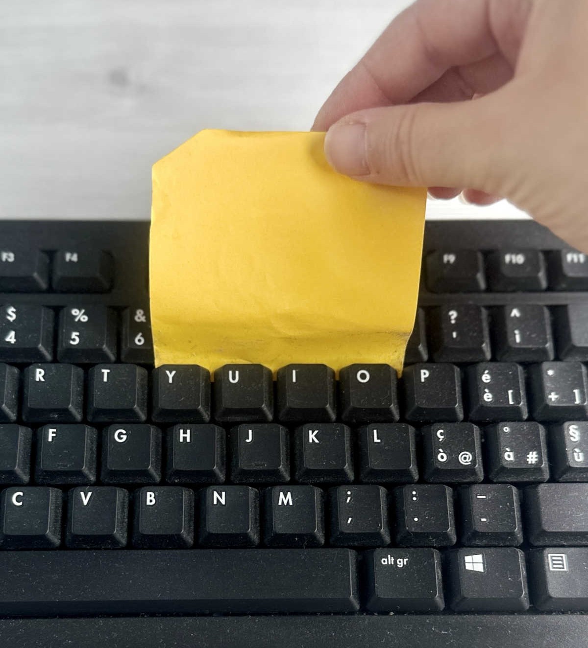 Use a Post-It to Clean Your Keyboard