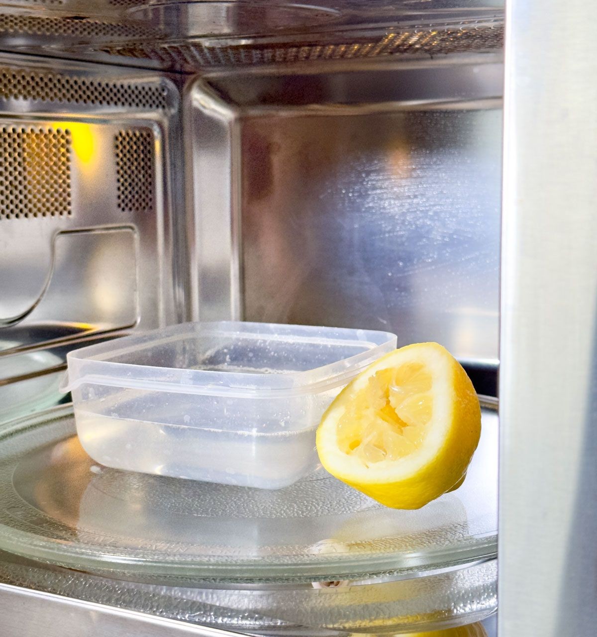 Easily Clean the Microwave with a Bowl of Water and Lemon Juice