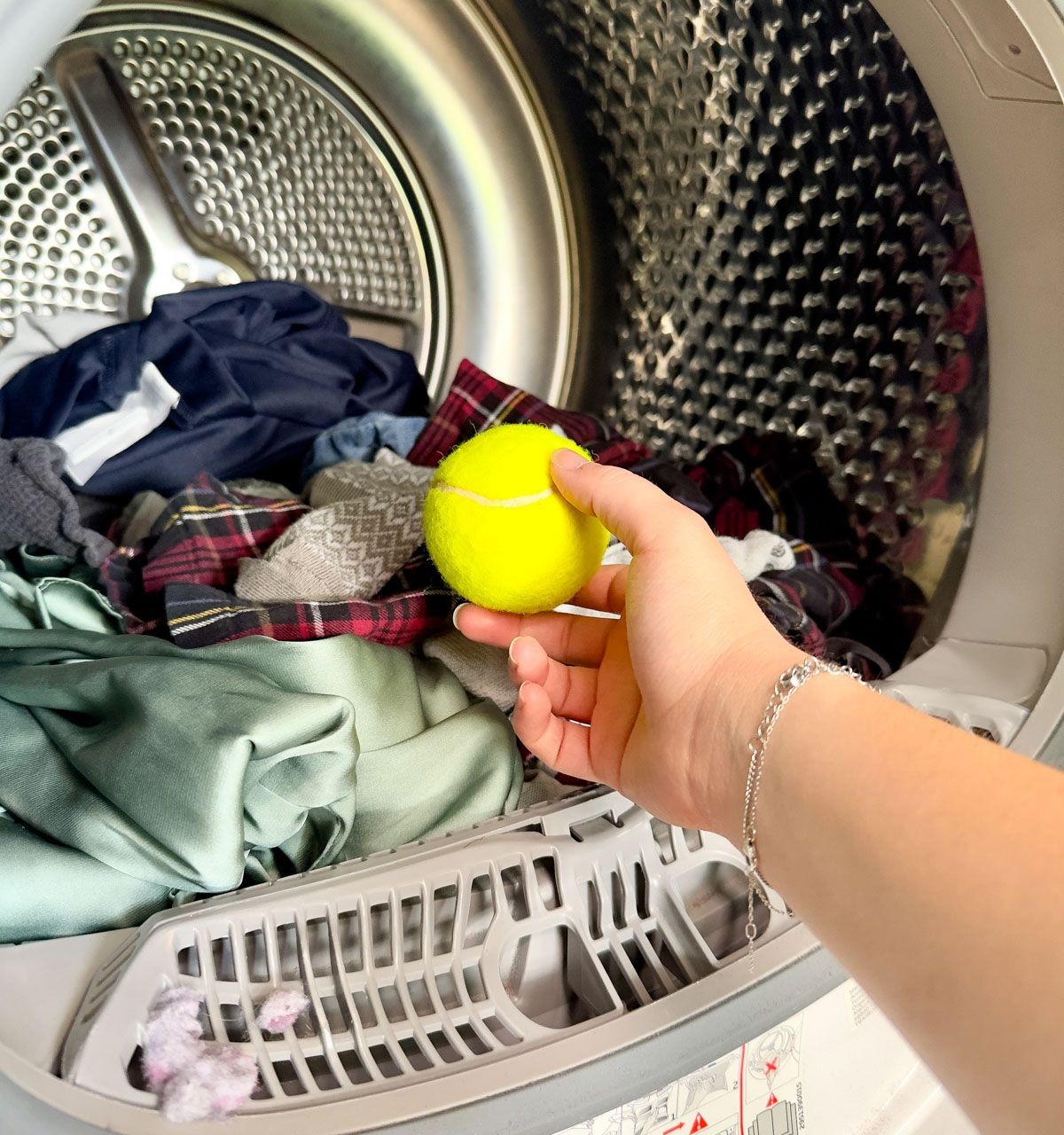 Place a Tennis Ball into the Dryer to Dry Clothes Faster